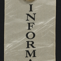 Information ribbon with golden bear and "Votes for Women" pin attached